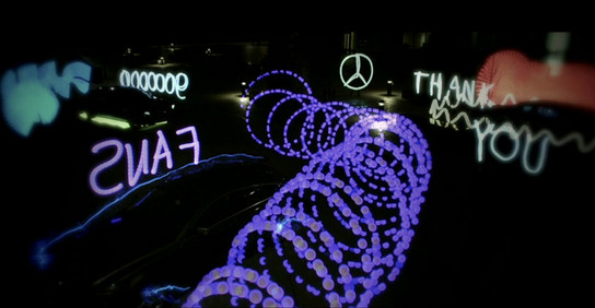 mercedes fans at Mercedes Thanks 9 Million Facebook Fans With Light Show
