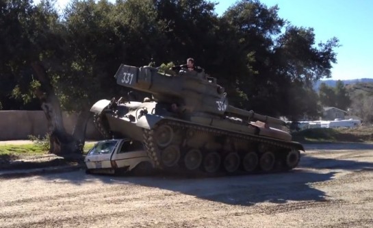 Arnold in Tank 545x333 at Still Got it: Arnie Crushes a Car with His Tank