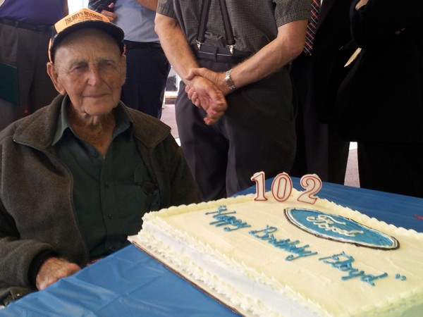 Floyd with Cake 600x450 at 102 Year Old Man Named Honorary Ford Trucks President!