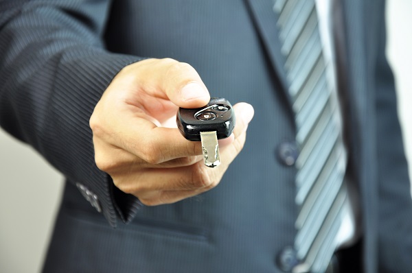 Man Giving Car Key at Huge Toyota Recalls