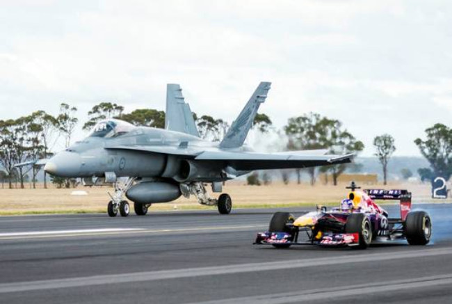 redbull vs jet at Red Bull F1 Car Takes on F/A 18 Hornet Fighter Jet
