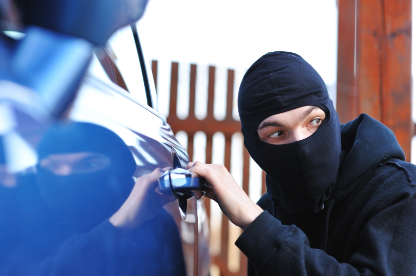 thief stealing a car at How to prevent your car from being stolen?