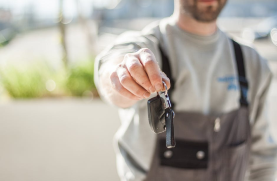 man with car key 550x360 at When Should You Sell Your Car? Signs You Need to Do It Now