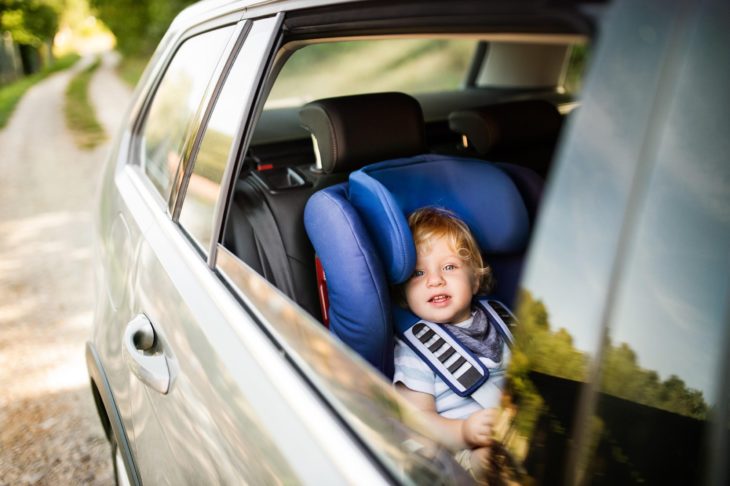 kid in a car 730x486 at 5 Expert Tips to Get a Good Deal On a Used Car