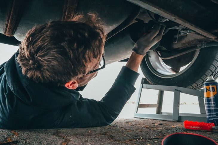 mechanic under car 730x487 at Tips to Find the Right Mechanic for Your Commercial Vehicles