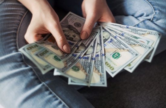 dollar bills 550x360 at 5 Best Things to Buy and Sell to Make Money