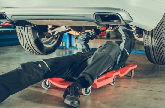 man working car 550x360 at How to Improve Your Car’s Performance with Performance Exhausts