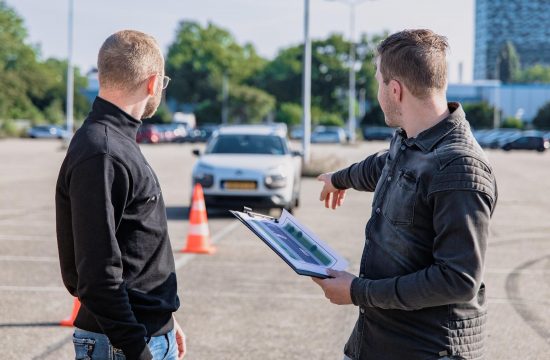 men looking at car 550x360 at How Do I Get My License Back After it Has Been Suspended for DUI?