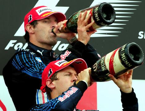 webber drinking at F1: Mark Webber wins his first Grand Prix in Germany