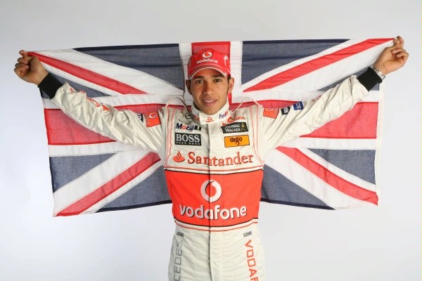 lewis hamilton with union jack at Lewis Hamliton joins the greats at Madame Tussauds museum